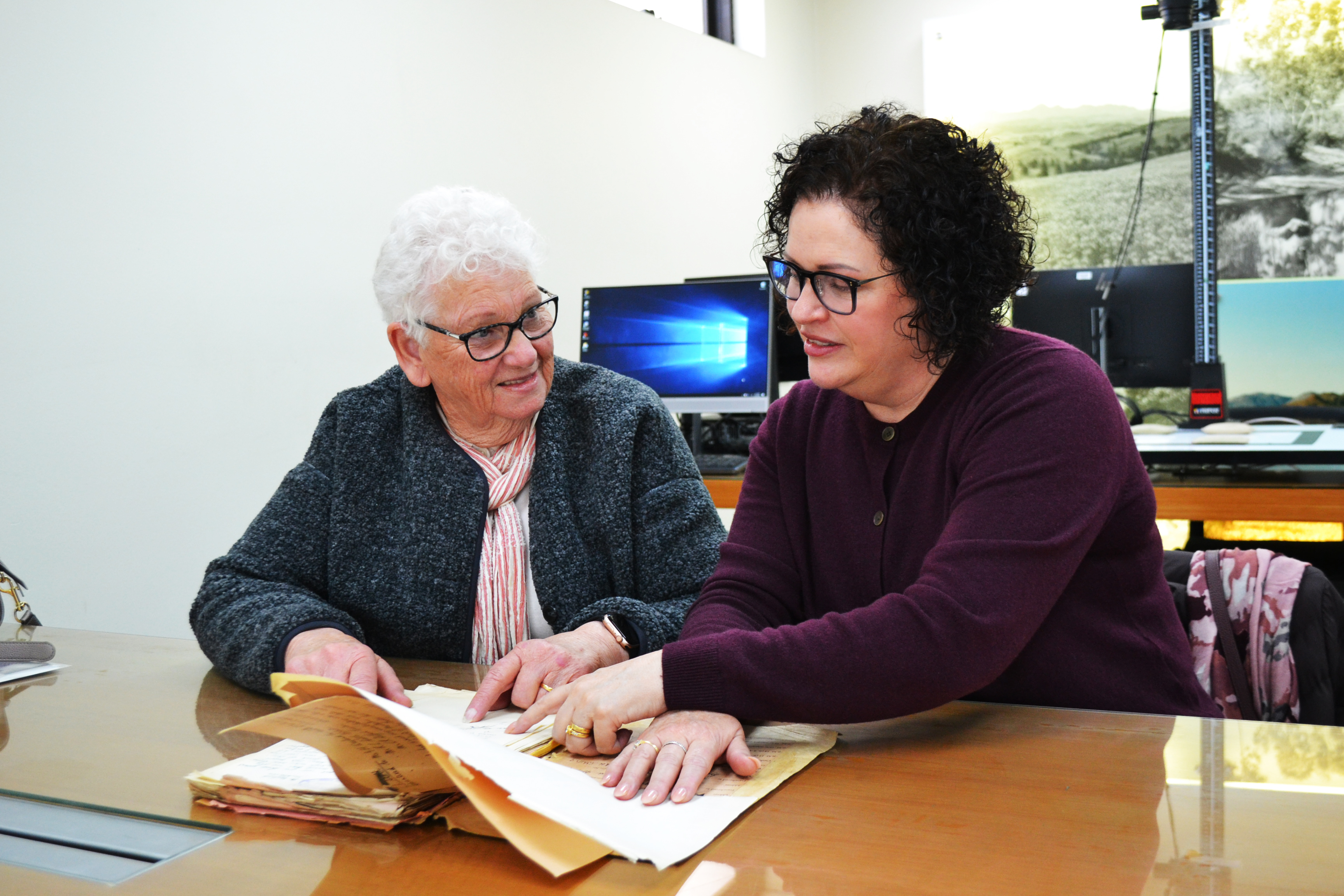 Natalie and Joanne with the ‘priceless’ documents they discovered of Leo Leonard Scott within State Records of South Australia’s Gepps Cross repository. Picture by SRSA